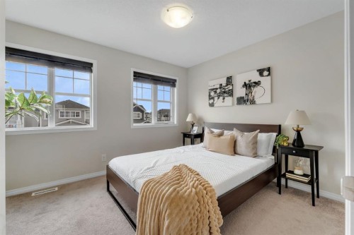 121 Osborne Common Sw, Airdrie, AB - Indoor Photo Showing Bedroom