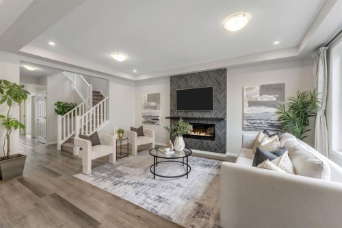 121 Osborne Common Sw, Airdrie, AB - Indoor Photo Showing Living Room With Fireplace