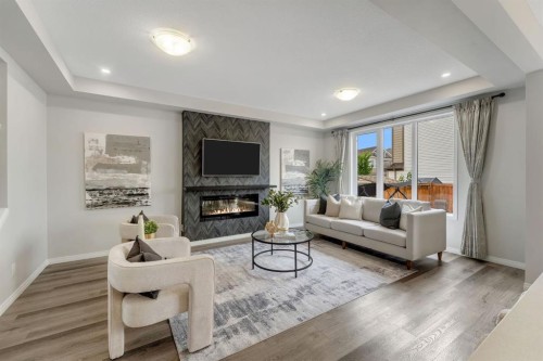121 Osborne Common Sw, Airdrie, AB - Indoor Photo Showing Living Room With Fireplace