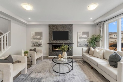 121 Osborne Common Sw, Airdrie, AB - Indoor Photo Showing Living Room With Fireplace