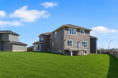 67 Lakes Estates Circle, Strathmore, AB - Outdoor With Backyard With Exterior