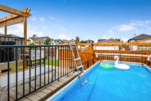 2004 4 Avenue Se, High River, AB - Outdoor With Above Ground Pool With Deck Patio Veranda With Exterior