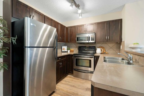 5209-69 Country Village Manor Ne, Calgary, AB - Indoor Photo Showing Kitchen With Stainless Steel Kitchen With Double Sink