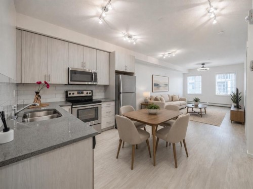 4309-215 Legacy Boulevard Se, Calgary, AB - Indoor Photo Showing Kitchen With Stainless Steel Kitchen With Double Sink