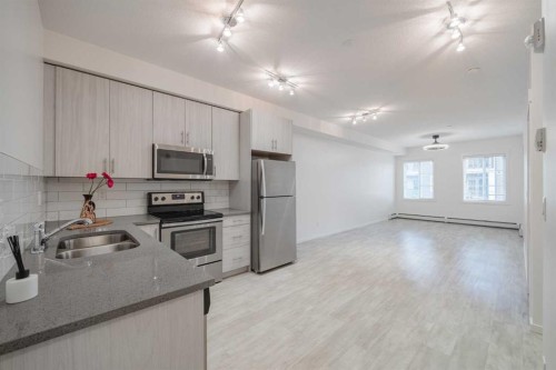 4309-215 Legacy Boulevard Se, Calgary, AB - Indoor Photo Showing Kitchen With Stainless Steel Kitchen With Double Sink