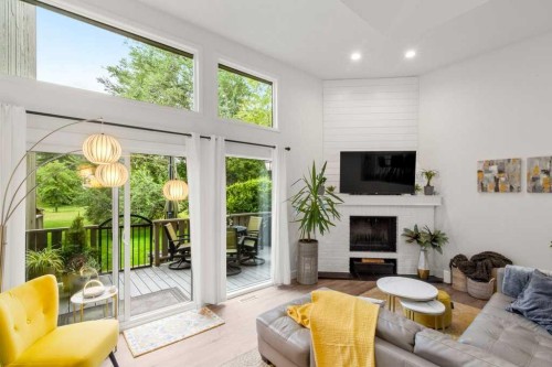 3909 Point Mckay Road Nw, Calgary, AB - Indoor Photo Showing Living Room With Fireplace