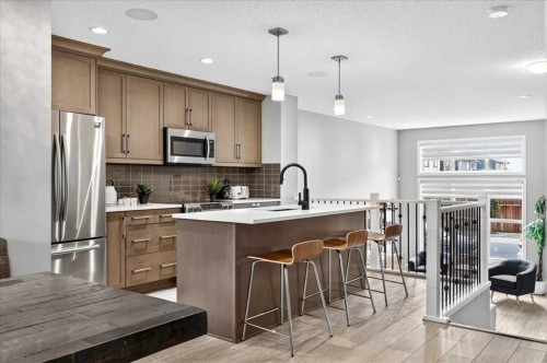 25 Masters Street Se, Calgary, AB - Indoor Photo Showing Kitchen With Stainless Steel Kitchen With Upgraded Kitchen
