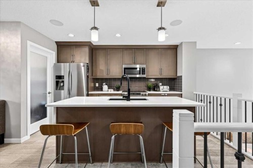 25 Masters Street Se, Calgary, AB - Indoor Photo Showing Kitchen With Stainless Steel Kitchen With Upgraded Kitchen