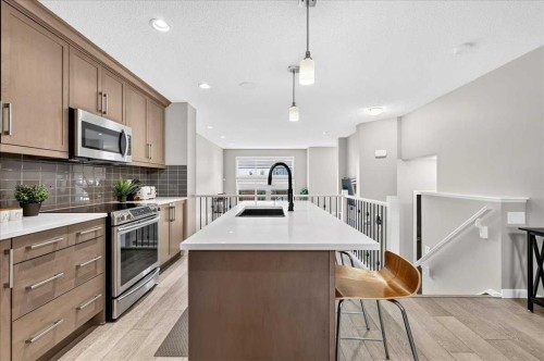 25 Masters Street Se, Calgary, AB - Indoor Photo Showing Kitchen With Stainless Steel Kitchen With Double Sink With Upgraded Kitchen