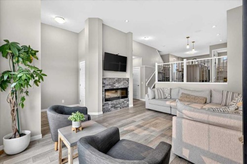 25 Masters Street Se, Calgary, AB - Indoor Photo Showing Living Room With Fireplace