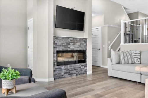 25 Masters Street Se, Calgary, AB - Indoor Photo Showing Living Room With Fireplace