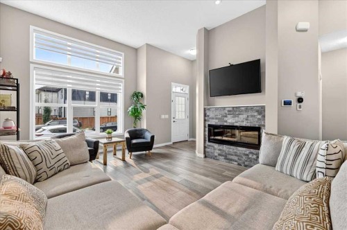 25 Masters Street Se, Calgary, AB - Indoor Photo Showing Living Room With Fireplace
