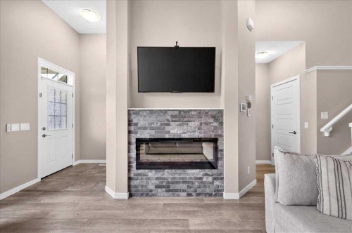 25 Masters Street Se, Calgary, AB - Indoor With Fireplace