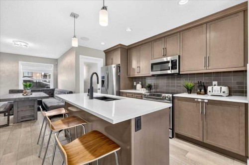 25 Masters Street Se, Calgary, AB - Indoor Photo Showing Kitchen With Stainless Steel Kitchen With Double Sink With Upgraded Kitchen