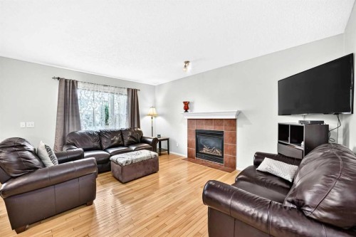 960 Copperfield Boulevard Se, Calgary, AB - Indoor Photo Showing Living Room With Fireplace