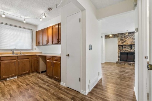 1491 Berkley Drive Nw, Calgary, AB - Indoor Photo Showing Kitchen With Double Sink