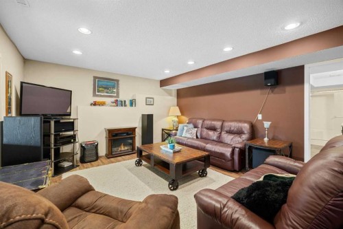 354 West Creek Springs, Chestermere, AB - Indoor Photo Showing Living Room With Fireplace