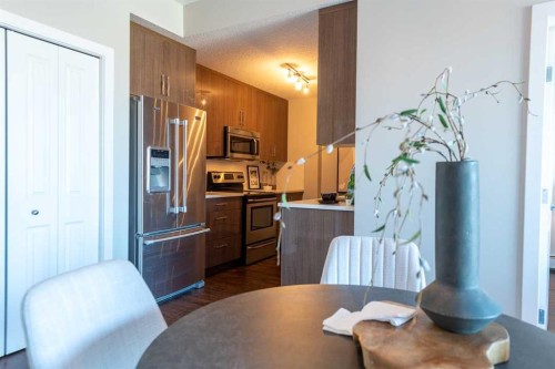 403-607 17 Avenue Nw, Calgary, AB - Indoor Photo Showing Kitchen With Stainless Steel Kitchen