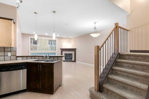 103-1606 4 Street Nw, Calgary, AB - Indoor Photo Showing Kitchen With Double Sink