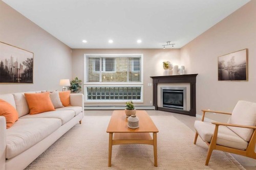 103-1606 4 Street Nw, Calgary, AB - Indoor Photo Showing Living Room With Fireplace