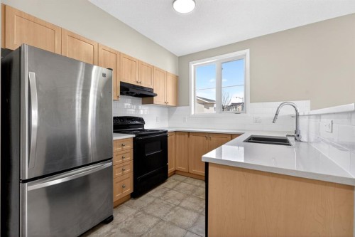 2102-333 Taravista Drive Ne, Calgary, AB - Indoor Photo Showing Kitchen With Double Sink