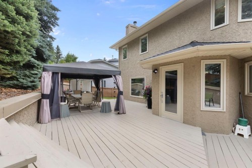 311 Woodhaven Bay Sw, Calgary, AB - Outdoor With Deck Patio Veranda With Exterior