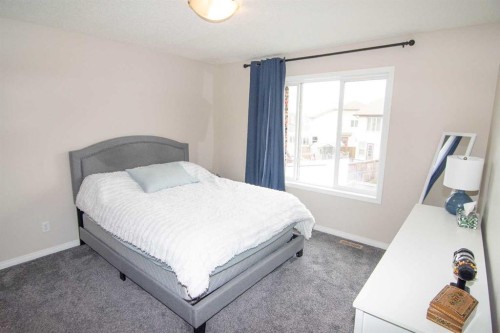 754 Luxstone Gate Sw, Airdrie, AB - Indoor Photo Showing Bedroom