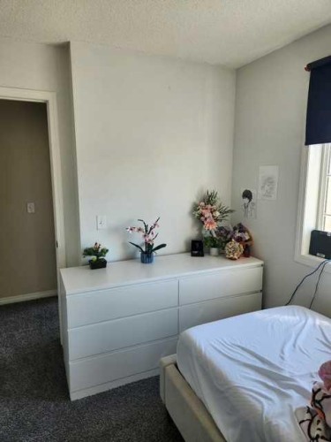 754 Luxstone Gate Sw, Airdrie, AB - Indoor Photo Showing Bedroom