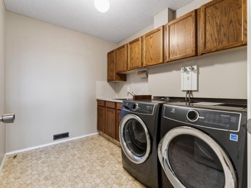 76 Deermoss Crescent Se, Calgary, AB - Indoor Photo Showing Laundry Room