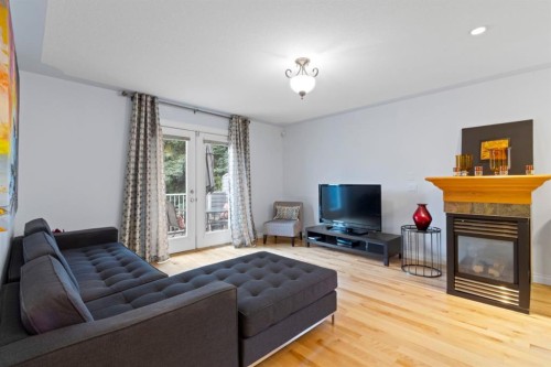 2323 5 Avenue Nw, Calgary, AB - Indoor Photo Showing Living Room With Fireplace