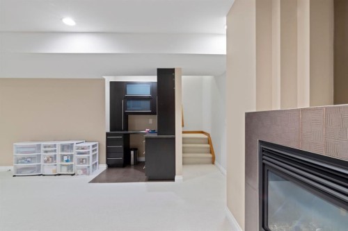 2323 5 Avenue Nw, Calgary, AB - Indoor Photo Showing Other Room With Fireplace