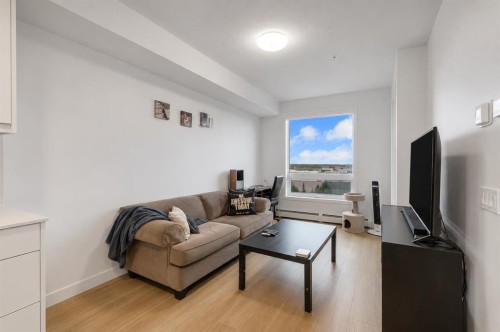 2509-8500 19 Avenue Se, Calgary, AB - Indoor Photo Showing Living Room
