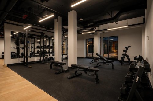 2509-8500 19 Avenue Se, Calgary, AB - Indoor Photo Showing Gym Room