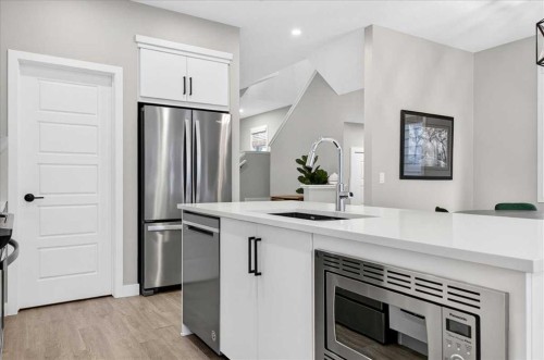 154 Masters Row Se, Calgary, AB - Indoor Photo Showing Kitchen With Stainless Steel Kitchen