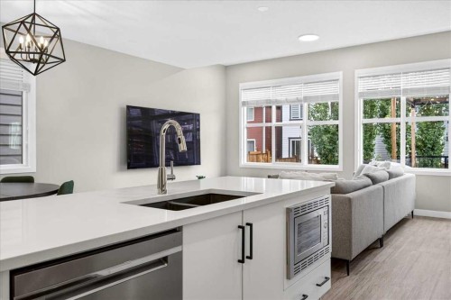 154 Masters Row Se, Calgary, AB - Indoor Photo Showing Kitchen With Double Sink