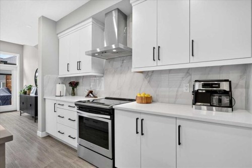 154 Masters Row Se, Calgary, AB - Indoor Photo Showing Kitchen With Upgraded Kitchen