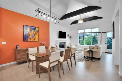 124-55 Fireside Circle, Cochrane, AB - Indoor Photo Showing Dining Room With Fireplace