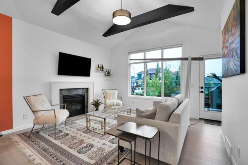 124-55 Fireside Circle, Cochrane, AB - Indoor Photo Showing Living Room With Fireplace