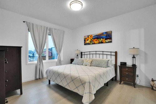 124-55 Fireside Circle, Cochrane, AB - Indoor Photo Showing Bedroom