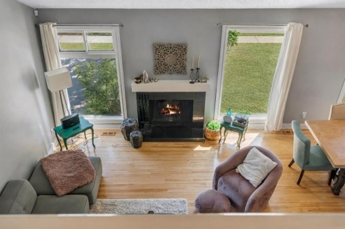 12 Oakvale Place Sw, Calgary, AB - Indoor Photo Showing Living Room With Fireplace