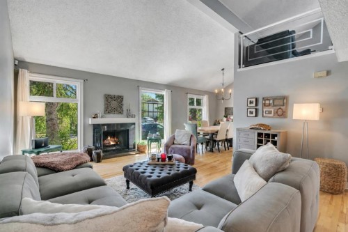 12 Oakvale Place Sw, Calgary, AB - Indoor Photo Showing Living Room With Fireplace