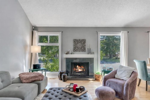 12 Oakvale Place Sw, Calgary, AB - Indoor Photo Showing Living Room With Fireplace
