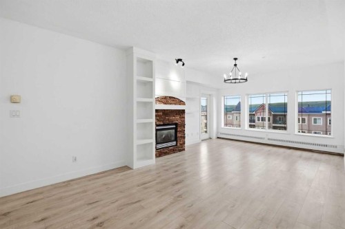 531-30 Discovery Ridge Close Sw, Calgary, AB - Indoor Photo Showing Living Room With Fireplace