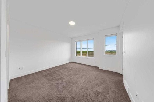 242 Carrington Gate Nw, Calgary, AB - Indoor Photo Showing Other Room