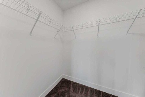 242 Carrington Gate Nw, Calgary, AB - Indoor With Storage