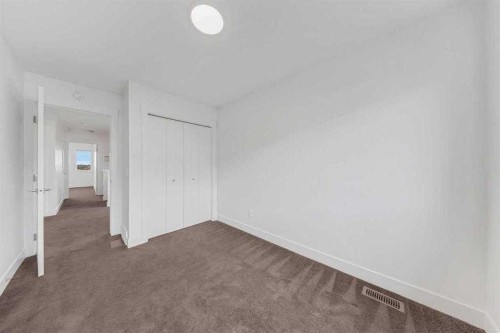 242 Carrington Gate Nw, Calgary, AB - Indoor Photo Showing Other Room