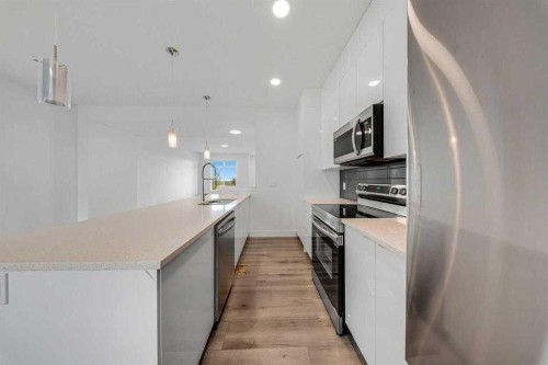 242 Carrington Gate Nw, Calgary, AB - Indoor Photo Showing Kitchen With Upgraded Kitchen