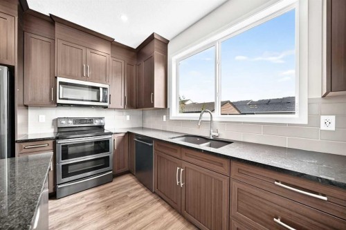 18 Willow Crescent, Okotoks, AB - Indoor Photo Showing Kitchen With Stainless Steel Kitchen