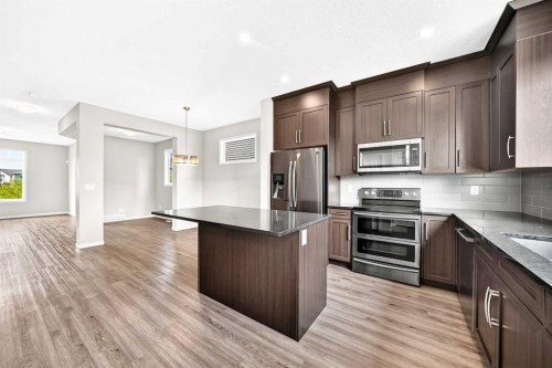 18 Willow Crescent, Okotoks, AB - Indoor Photo Showing Kitchen With Stainless Steel Kitchen With Upgraded Kitchen