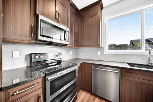 18 Willow Crescent, Okotoks, AB - Indoor Photo Showing Kitchen With Stainless Steel Kitchen
